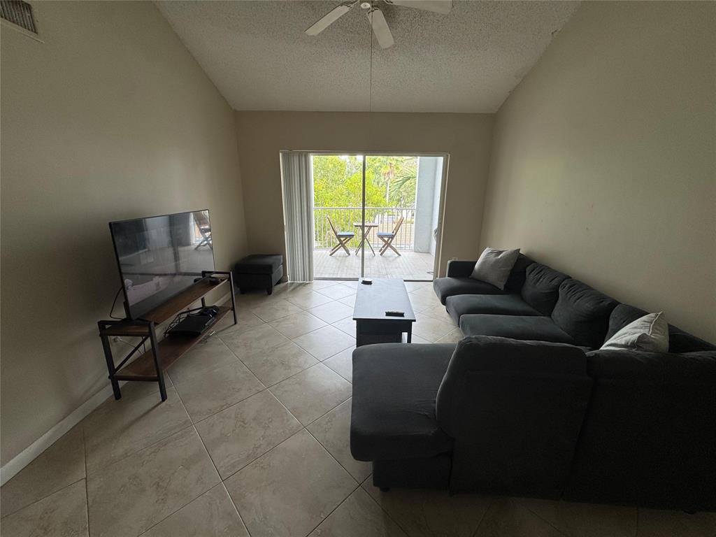 2600 South University Drive, Unit 309 Davie, FL 33328 - Photo 5 of 23 a living room with furniture and a window