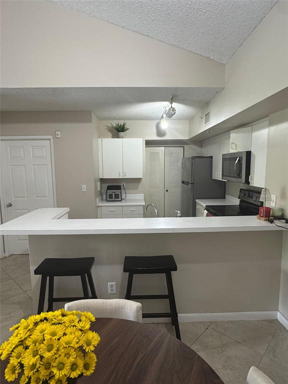 2600 South University Drive, Unit 309 Davie, FL 33328 - Photo 6 of 23 a kitchen with a sink cabinets and wooden floor