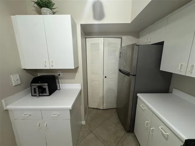 a kitchen with a sink a stove and refrigerator