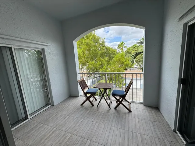 a view of a livingroom with furniture and windows