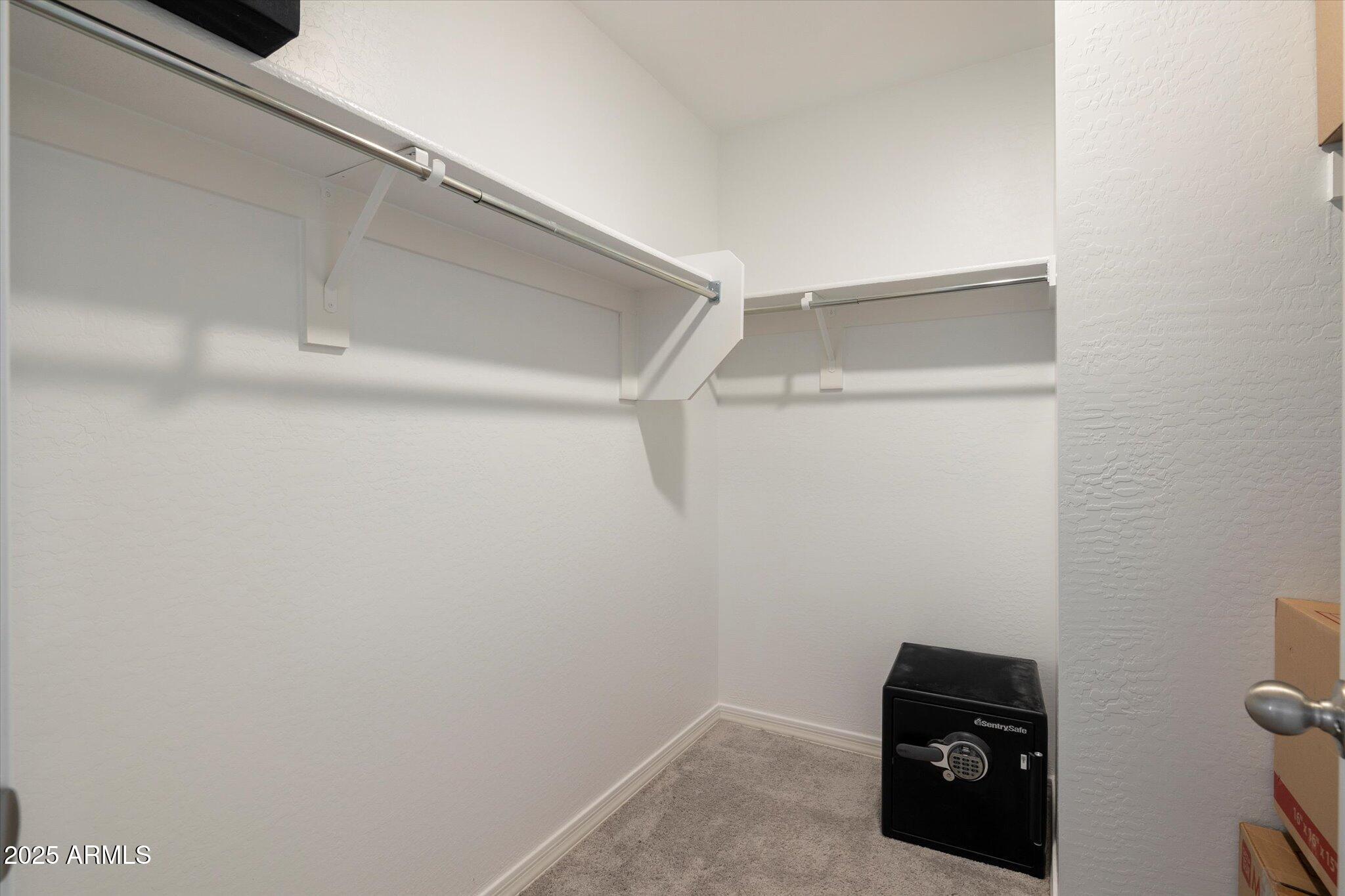 6350 West Latona Road Laveen, AZ 85339 - Photo 20 of 42 a view of small space with racks on the wall