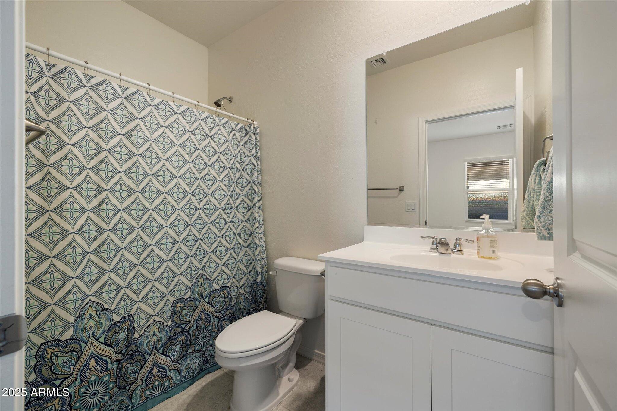 6350 West Latona Road Laveen, AZ 85339 - Photo 25 of 42 a bathroom with a sink and a toilet