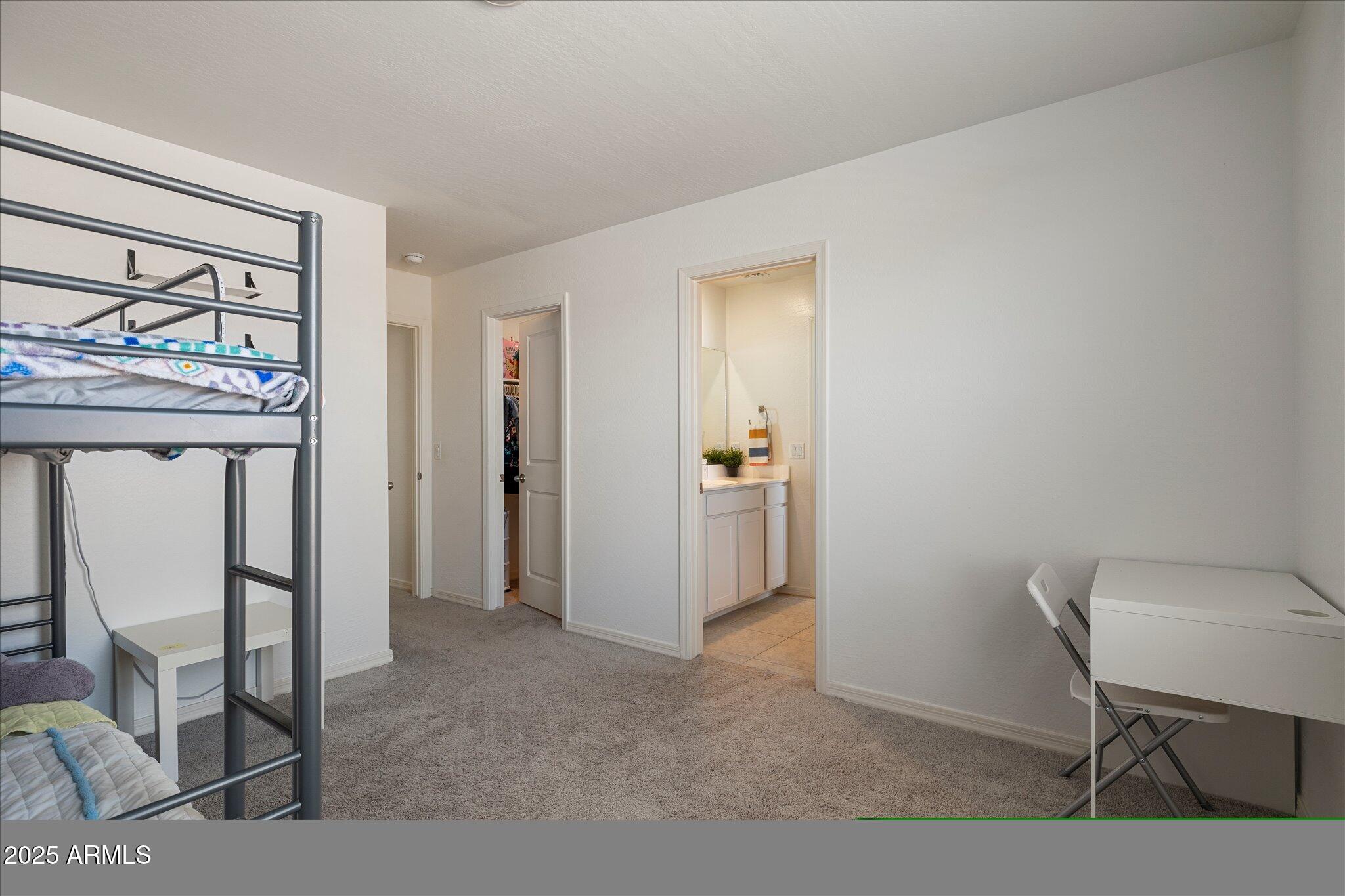 6350 West Latona Road Laveen, AZ 85339 - Photo 27 of 42 a view of room with furniture and a window