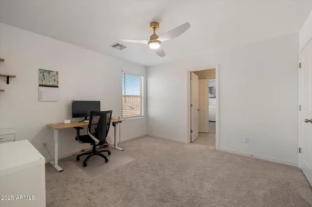 a bathroom with a bathtub shower sink vanity mirror and toilet