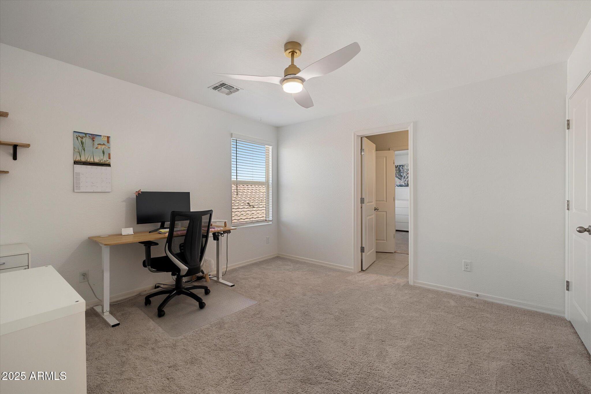 6350 West Latona Road Laveen, AZ 85339 - Photo 29 of 42 a view of a workspace with a window