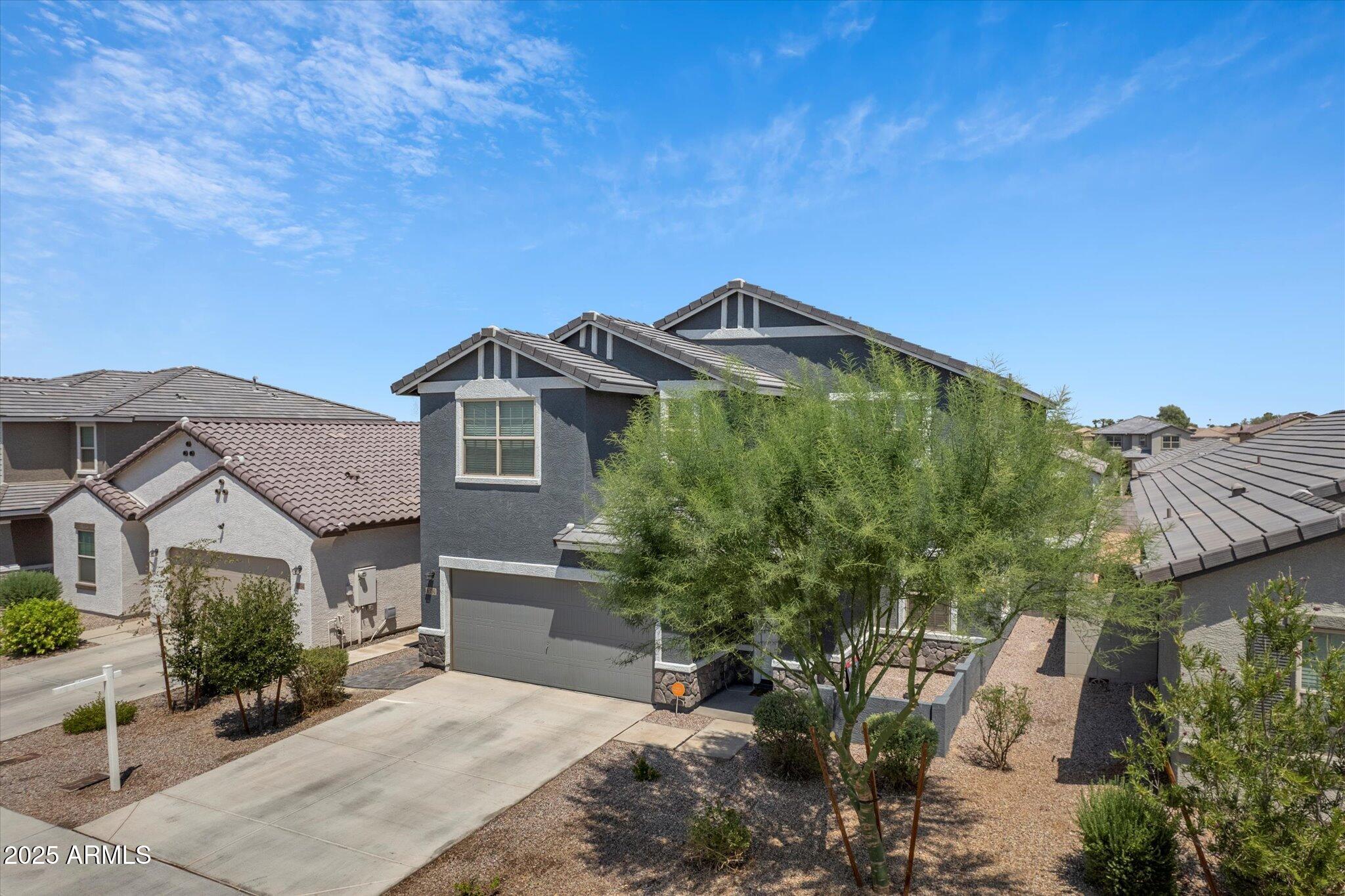 6350 West Latona Road Laveen, AZ 85339 - Photo 3 of 42 a front view of a house with a yard