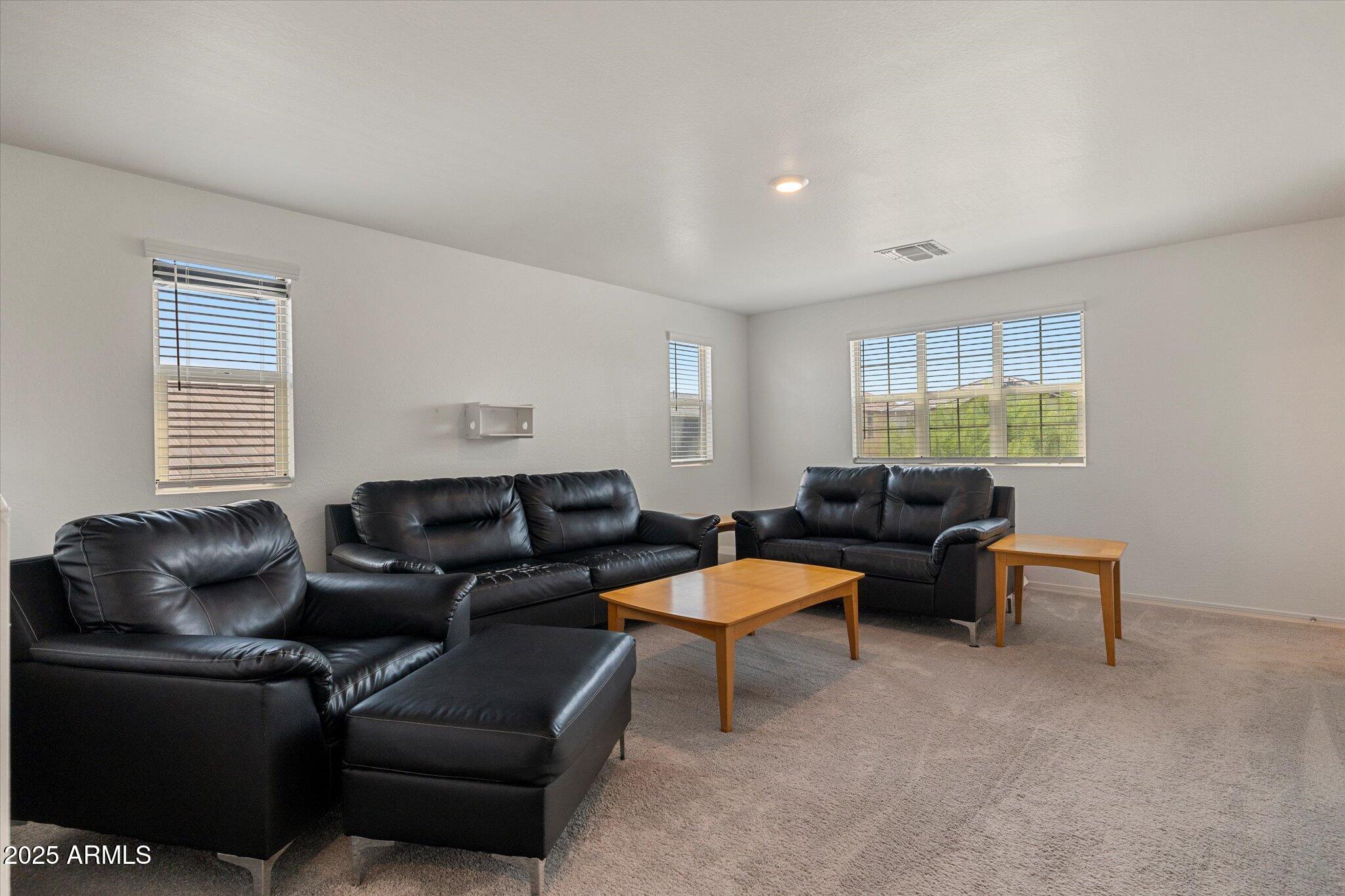 6350 West Latona Road Laveen, AZ 85339 - Photo 33 of 42 a living room with furniture and a window