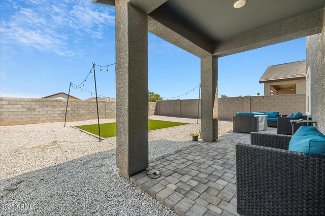 a house with swimming pool in front of it