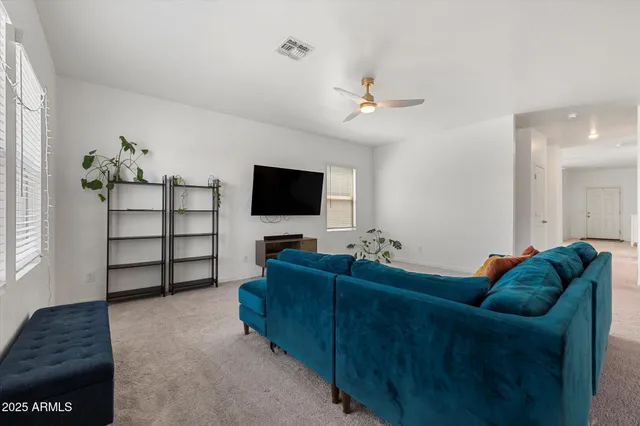 a view of a dining room with furniture and window