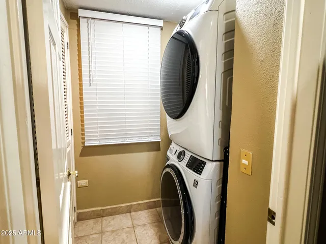 a view of a swimming pool with a table and chairs