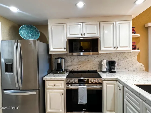 a kitchen with a stove microwave and refrigerator