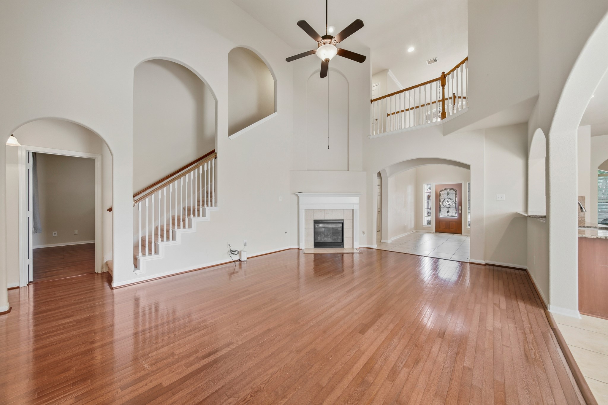 6015 Biltmore Court Rosenberg, TX 77471 - Photo 11 of 31 a view of empty room with wooden floor and fan