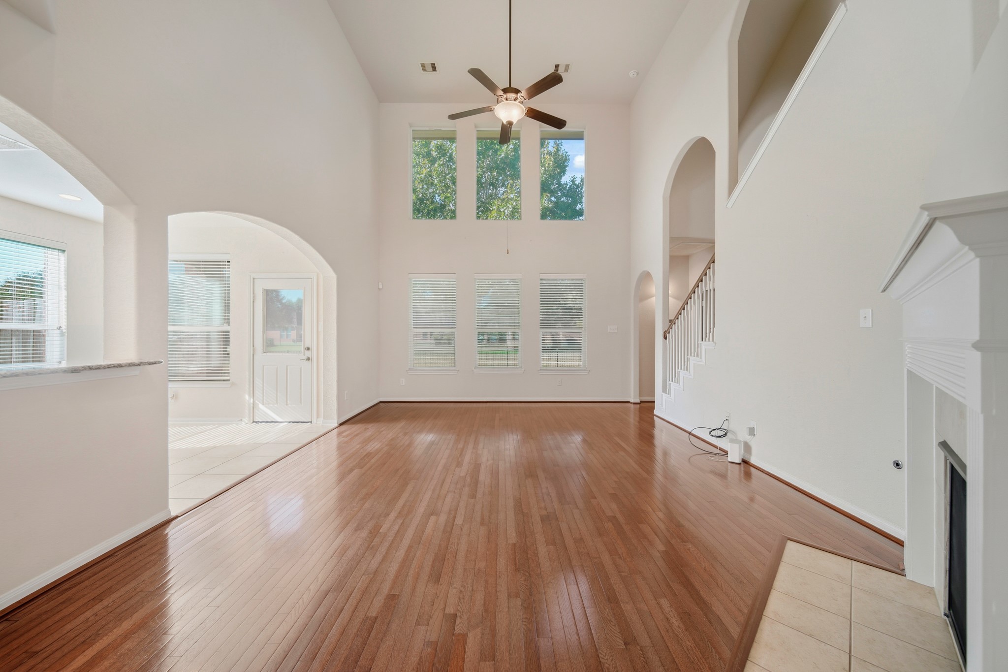 6015 Biltmore Court Rosenberg, TX 77471 - Photo 12 of 31 wooden floor in an empty room with a window
