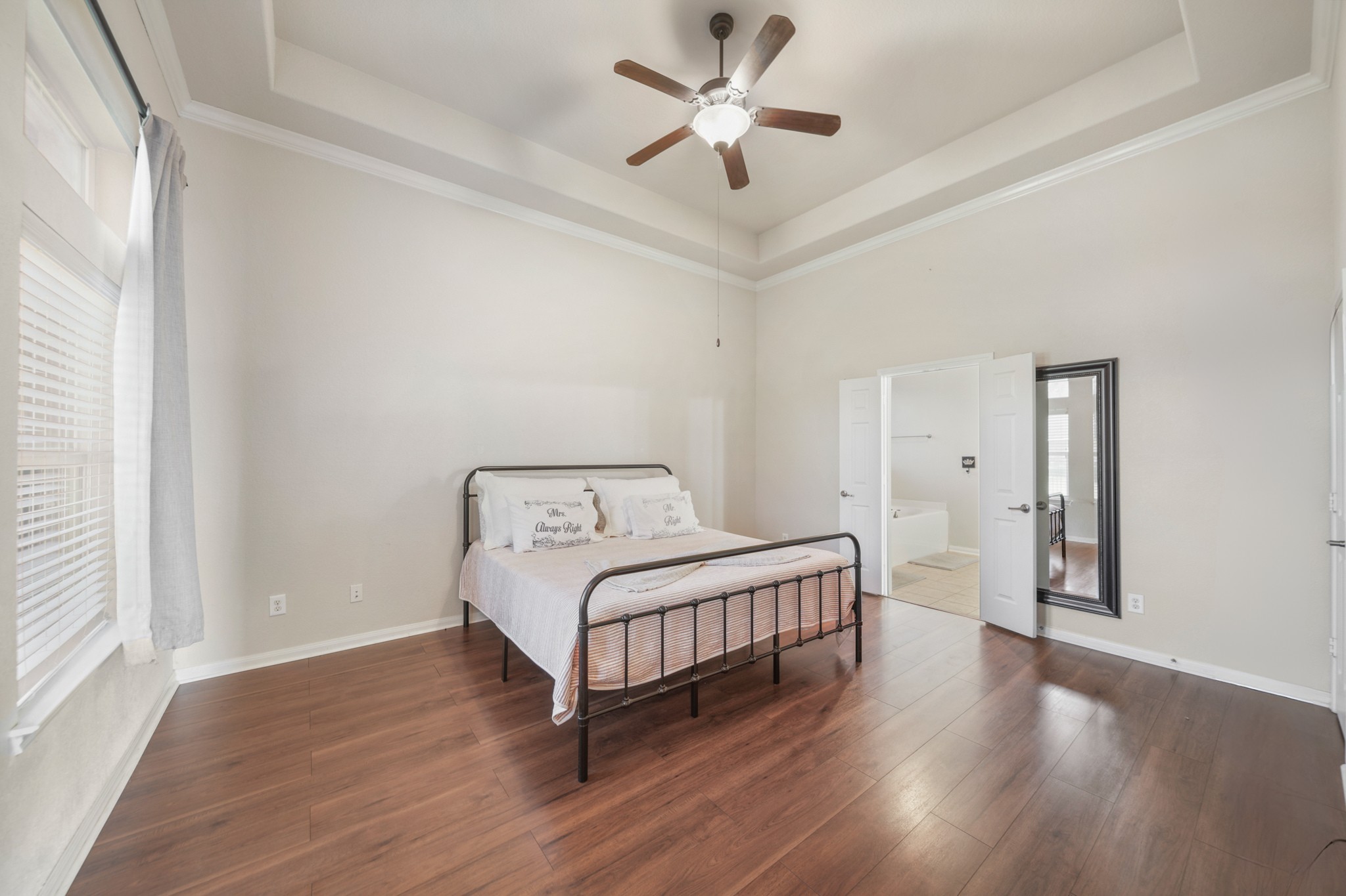 6015 Biltmore Court Rosenberg, TX 77471 - Photo 14 of 31 a bedroom with a bed and a chandelier
