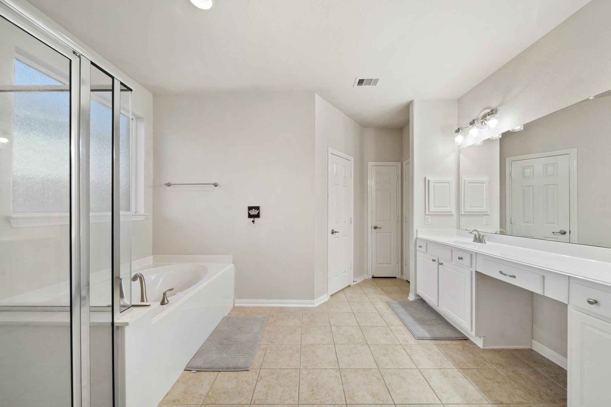 6015 Biltmore Court Rosenberg, TX 77471 - Photo 15 of 31 a bathroom with a tub sink shower and mirror