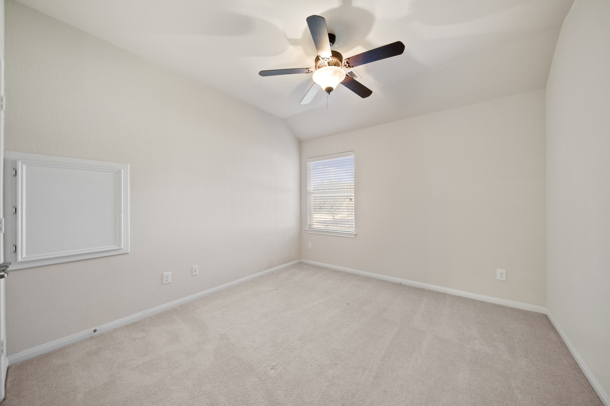 6015 Biltmore Court Rosenberg, TX 77471 - Photo 21 of 31 an empty room with windows and fan