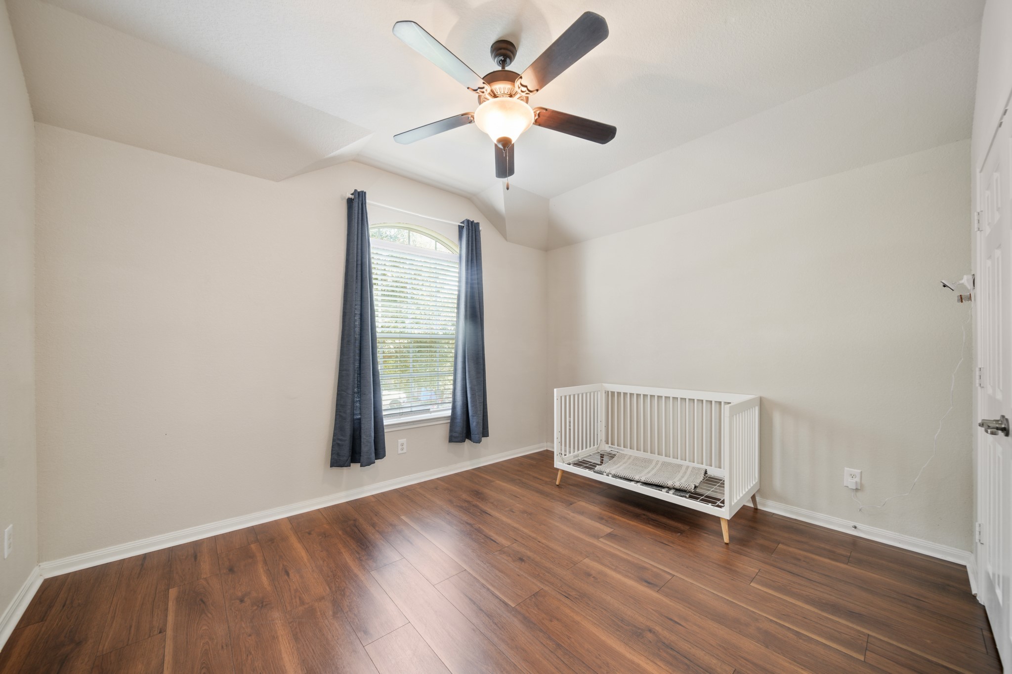 6015 Biltmore Court Rosenberg, TX 77471 - Photo 23 of 31 a view of an empty room with a window and wooden floor