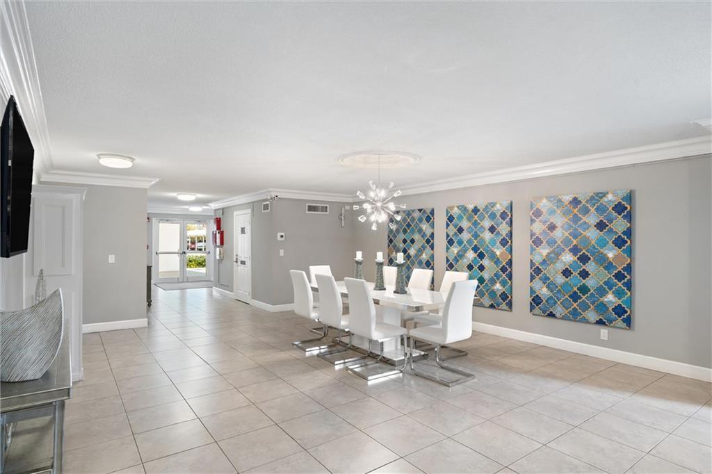 1439 South Ocean Boulevard, Unit 211 Pompano Beach, FL 33062 - Photo 11 of 46 a view of a livingroom with furniture and furniture