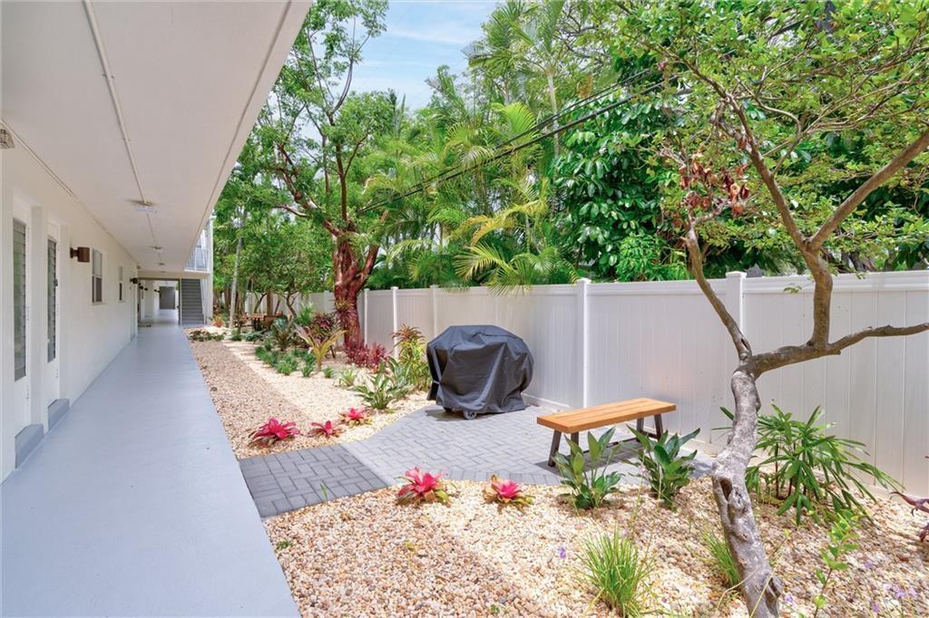 1439 South Ocean Boulevard, Unit 211 Pompano Beach, FL 33062 - Photo 13 of 46 a view of a table and chairs in patio