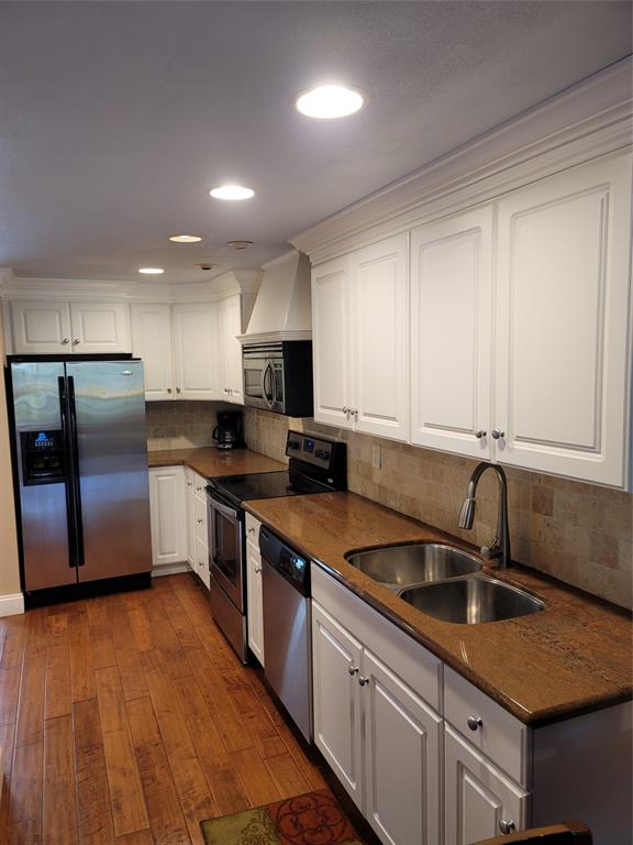 1439 South Ocean Boulevard, Unit 211 Pompano Beach, FL 33062 - Photo 20 of 46 a kitchen with stainless steel appliances granite countertop a sink a stove and a refrigerator