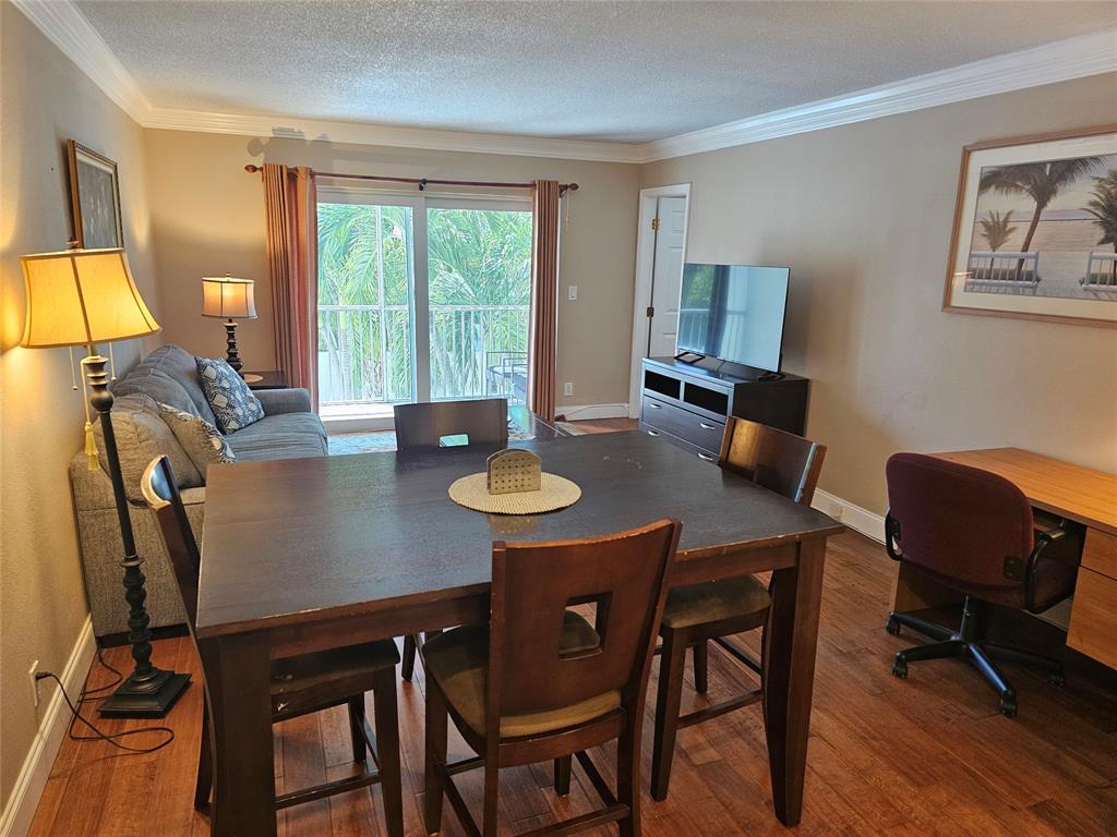 1439 South Ocean Boulevard, Unit 211 Pompano Beach, FL 33062 - Photo 23 of 46 a view of a dining room with furniture window and outside view