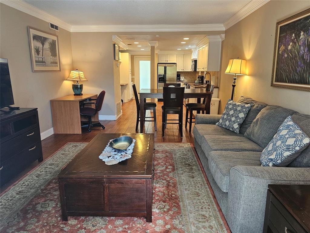 1439 South Ocean Boulevard, Unit 211 Pompano Beach, FL 33062 - Photo 24 of 46 a living room with furniture and a dining table