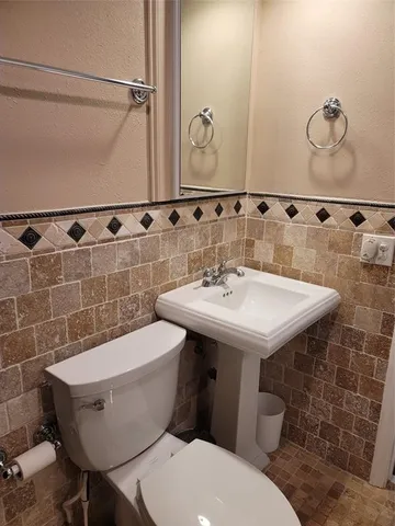 a bedroom with a bed and flat screen tv