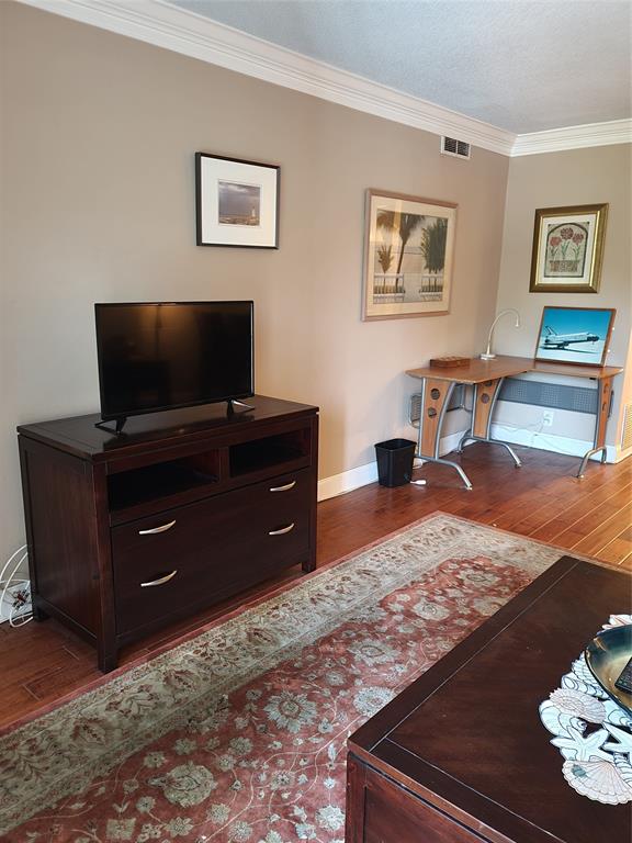 1439 South Ocean Boulevard, Unit 211 Pompano Beach, FL 33062 - Photo 25 of 46 a living room with furniture and a flat screen tv