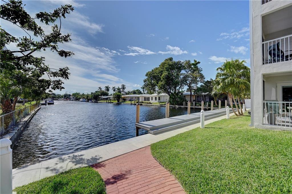 1439 South Ocean Boulevard, Unit 211 Pompano Beach, FL 33062 - Photo 7 of 46 a view of a garden with a house