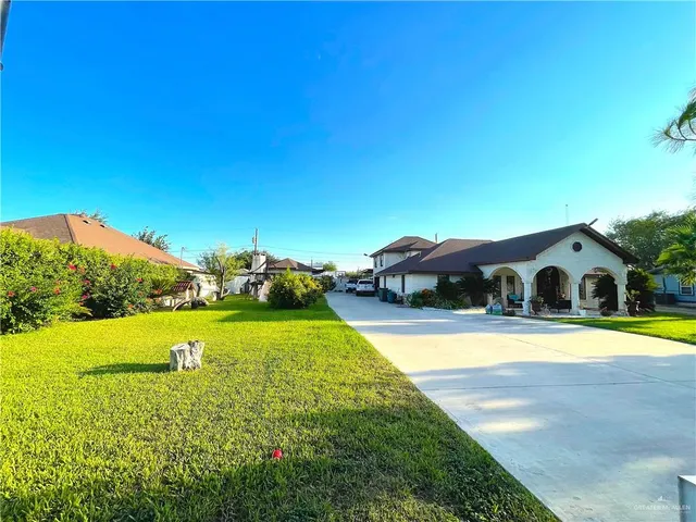a view of swimming pool with outdoor seating and yard