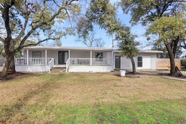 a house with trees in front of it