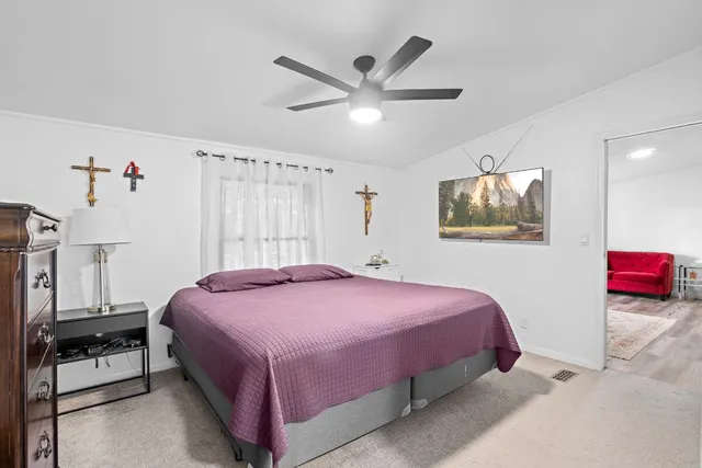 a bedroom with a bed and a closet