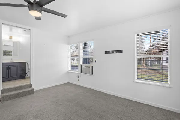 a view of an empty room with a window