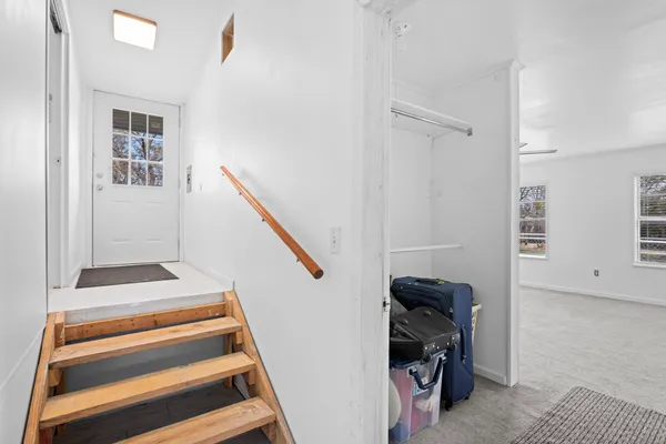 a view of entryway with stairs and furniture