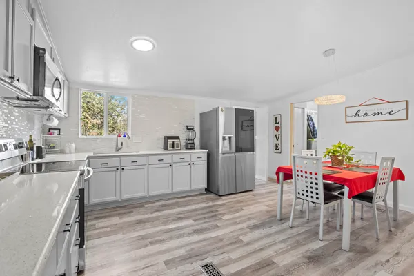 a kitchen with furniture and window