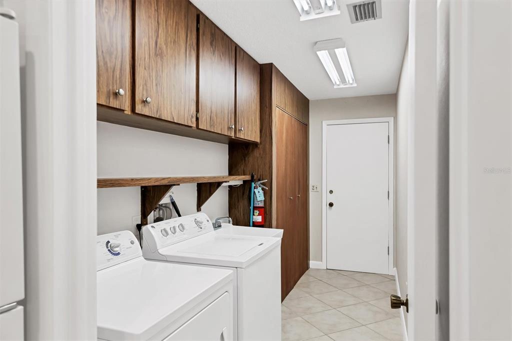 3930 Center Gate Circle, Unit 16 Sarasota, FL 34233 - Photo 24 of 30 a utility room with dryer and washer