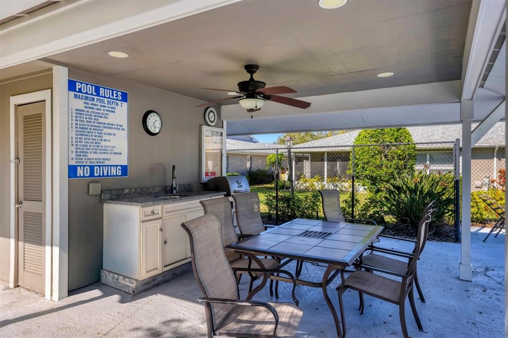 3930 Center Gate Circle, Unit 16 Sarasota, FL 34233 - Photo 29 of 30 a view of a dining room with furniture and window