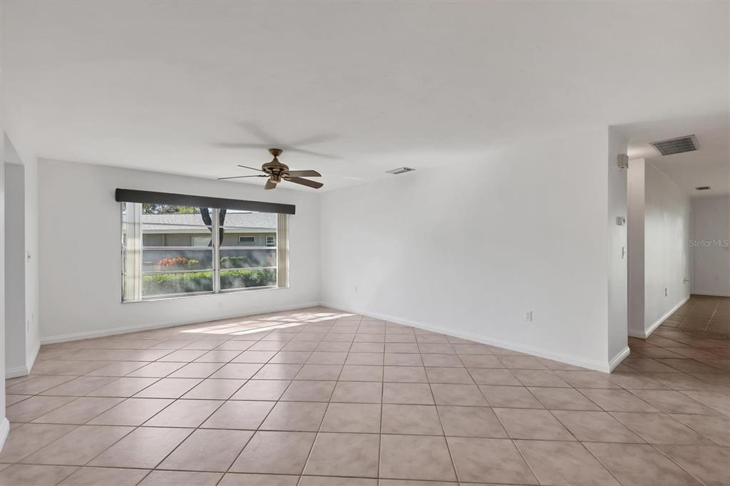 3930 Center Gate Circle, Unit 16 Sarasota, FL 34233 - Photo 5 of 30 a view of an empty room with a window