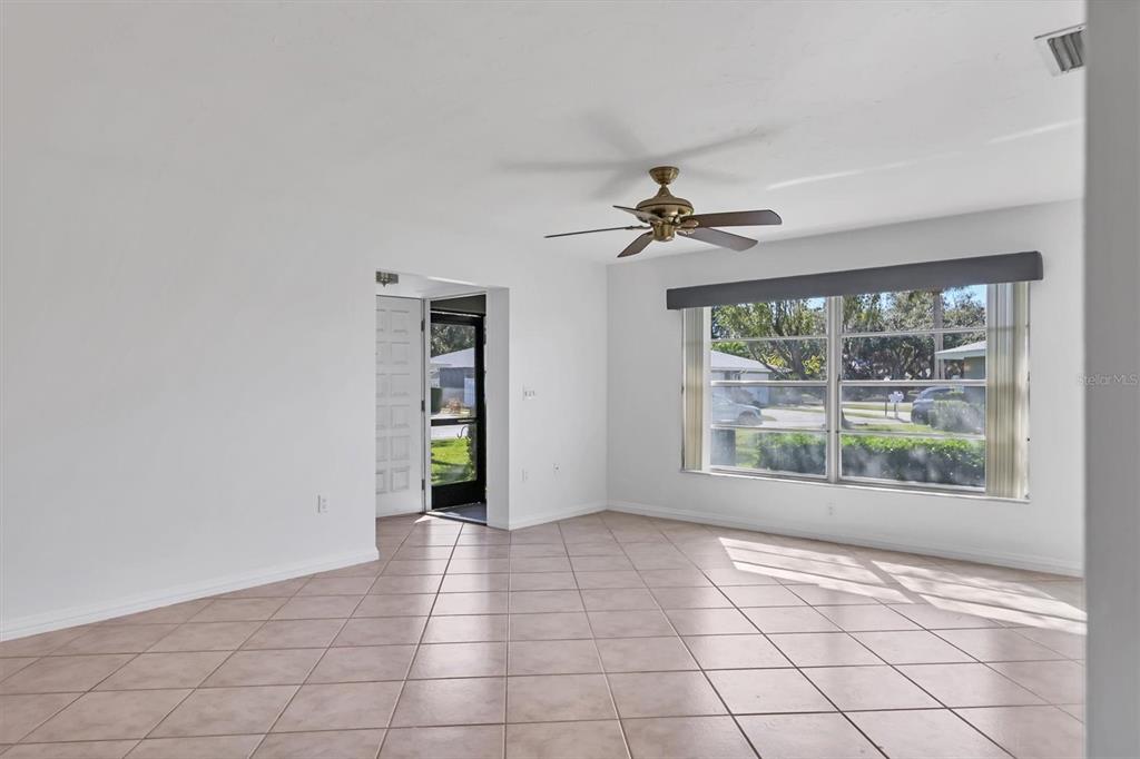 3930 Center Gate Circle, Unit 16 Sarasota, FL 34233 - Photo 6 of 30 a view of an empty room with a window
