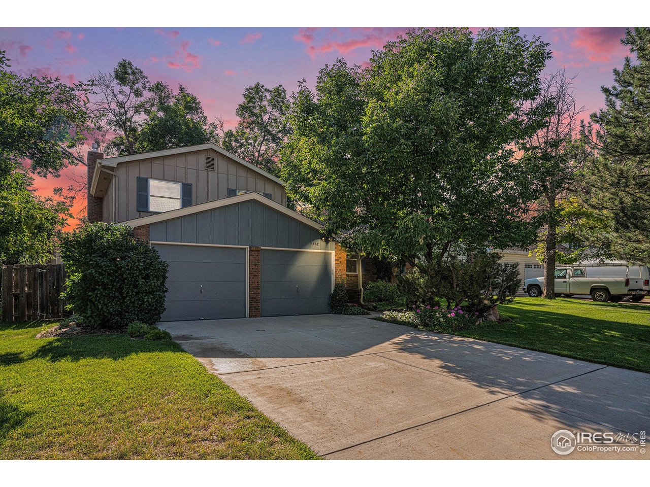 1918 Ridgewood Road Fort Collins, CO 80526 - Photo 1 of 30 Amazing view of the front of the home at twilight showcasing the oversized 2 car garage with driveway space for multiple vehicles