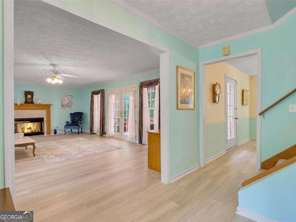 240 Riverview Road Jackson, GA 30233 - Photo 21 of 79 a view of a livingroom with wooden floor and a fireplace