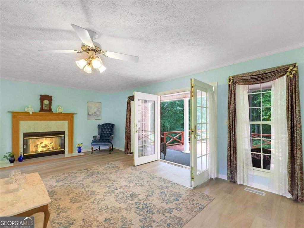 240 Riverview Road Jackson, GA 30233 - Photo 25 of 79 a view of an empty room with a fireplace and a window