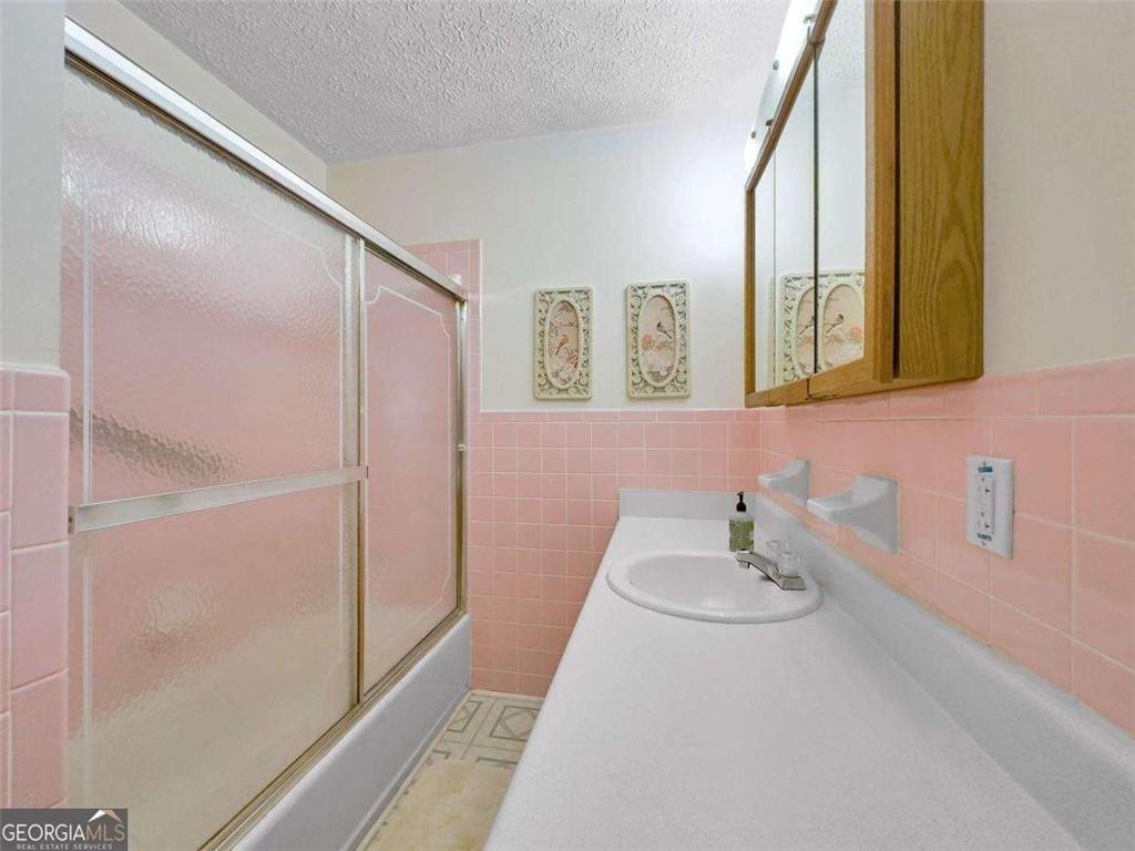 240 Riverview Road Jackson, GA 30233 - Photo 52 of 79 a bathroom with a sink and a mirror