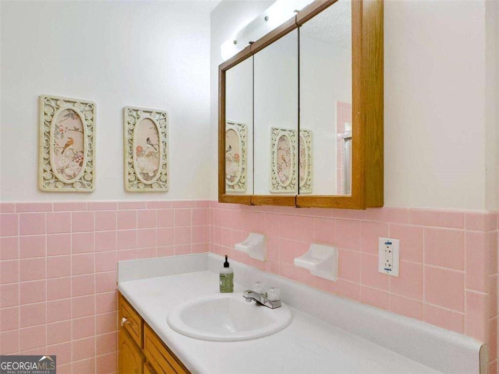 240 Riverview Road Jackson, GA 30233 - Photo 53 of 79 a bathroom with a sink and a mirror