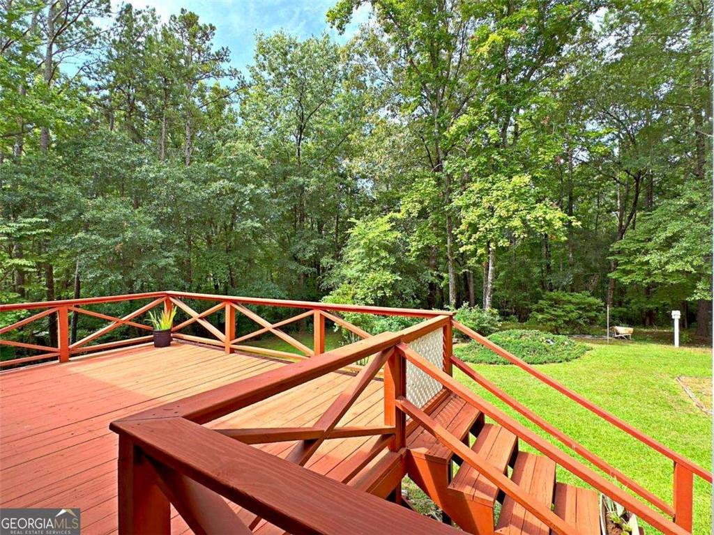 240 Riverview Road Jackson, GA 30233 - Photo 57 of 79 a view of a yard with a small deck