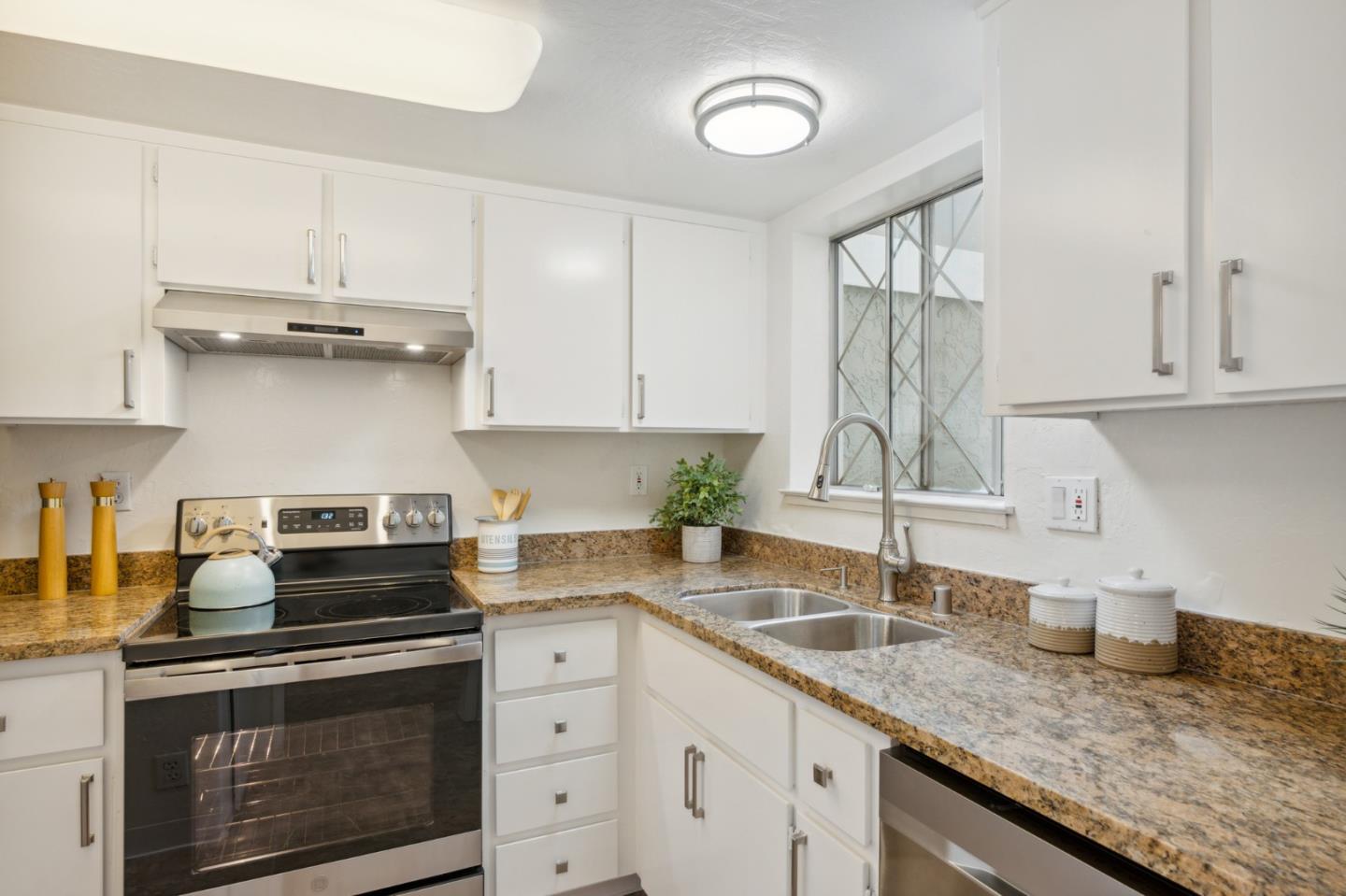 101 Redding Road, Unit B2 Campbell, CA 95008 - Photo 12 of 32 a kitchen with granite countertop a sink stainless steel appliances and cabinets