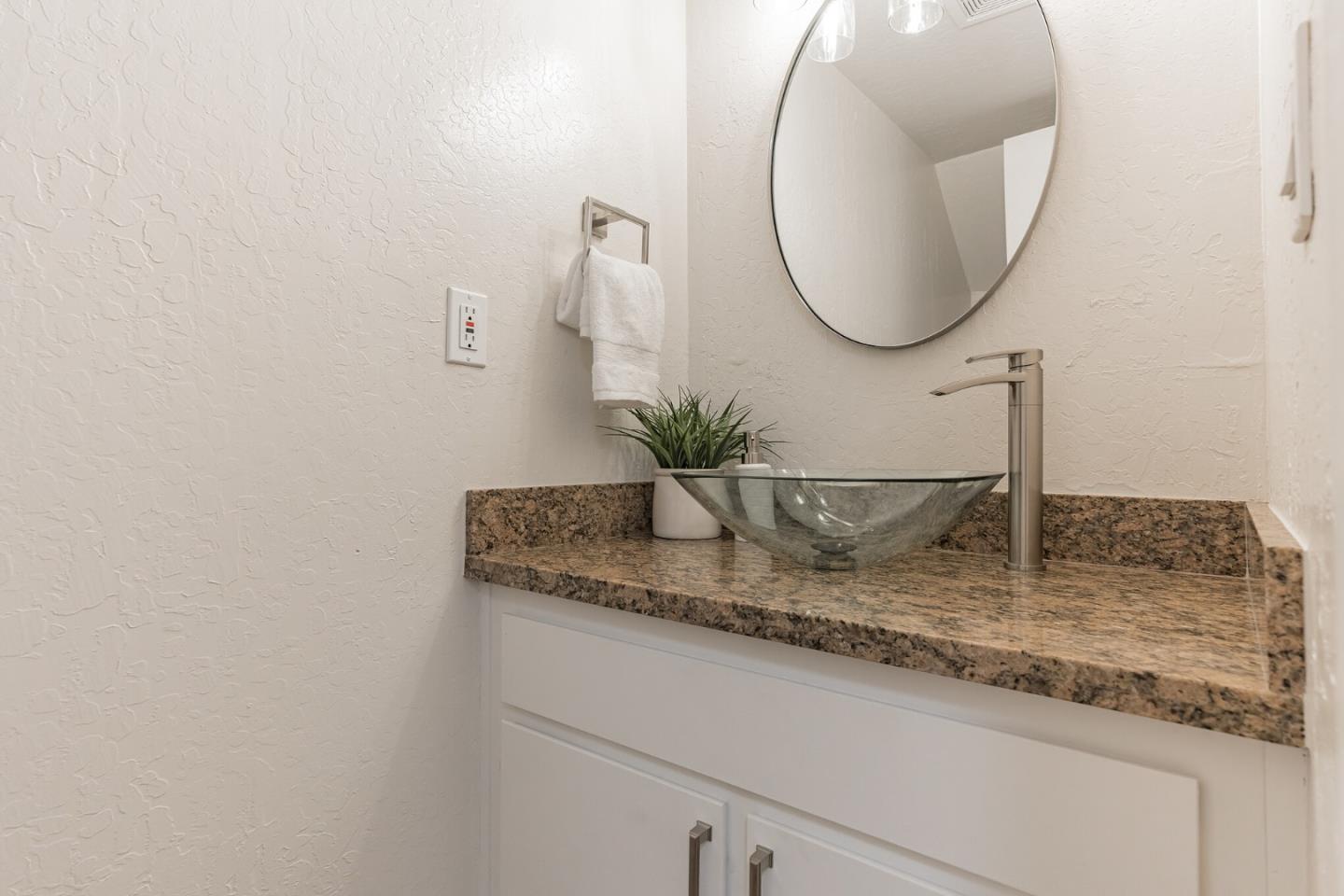101 Redding Road, Unit B2 Campbell, CA 95008 - Photo 13 of 32 a bathroom with a granite countertop sink and a mirror