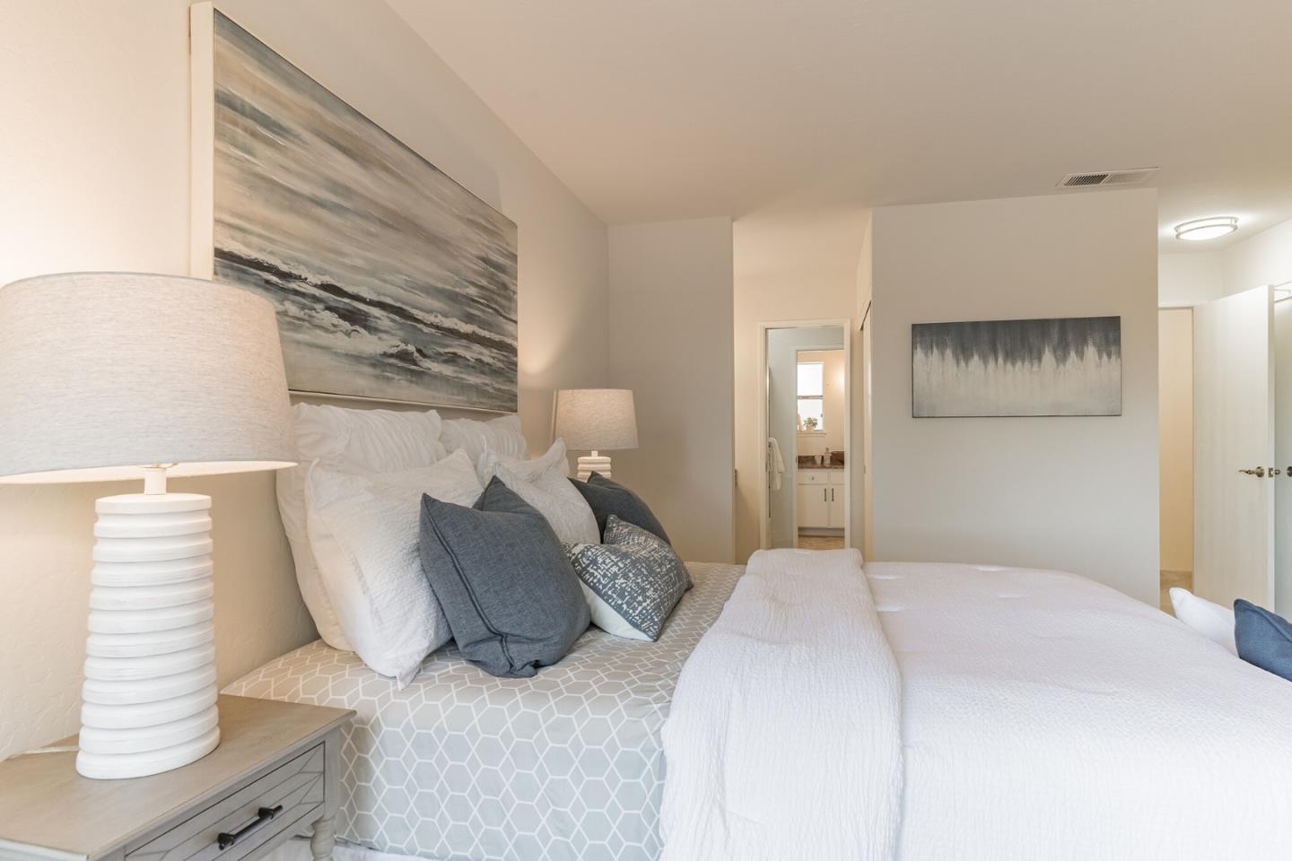 101 Redding Road, Unit B2 Campbell, CA 95008 - Photo 21 of 32 a bedroom with a bed and a night stand