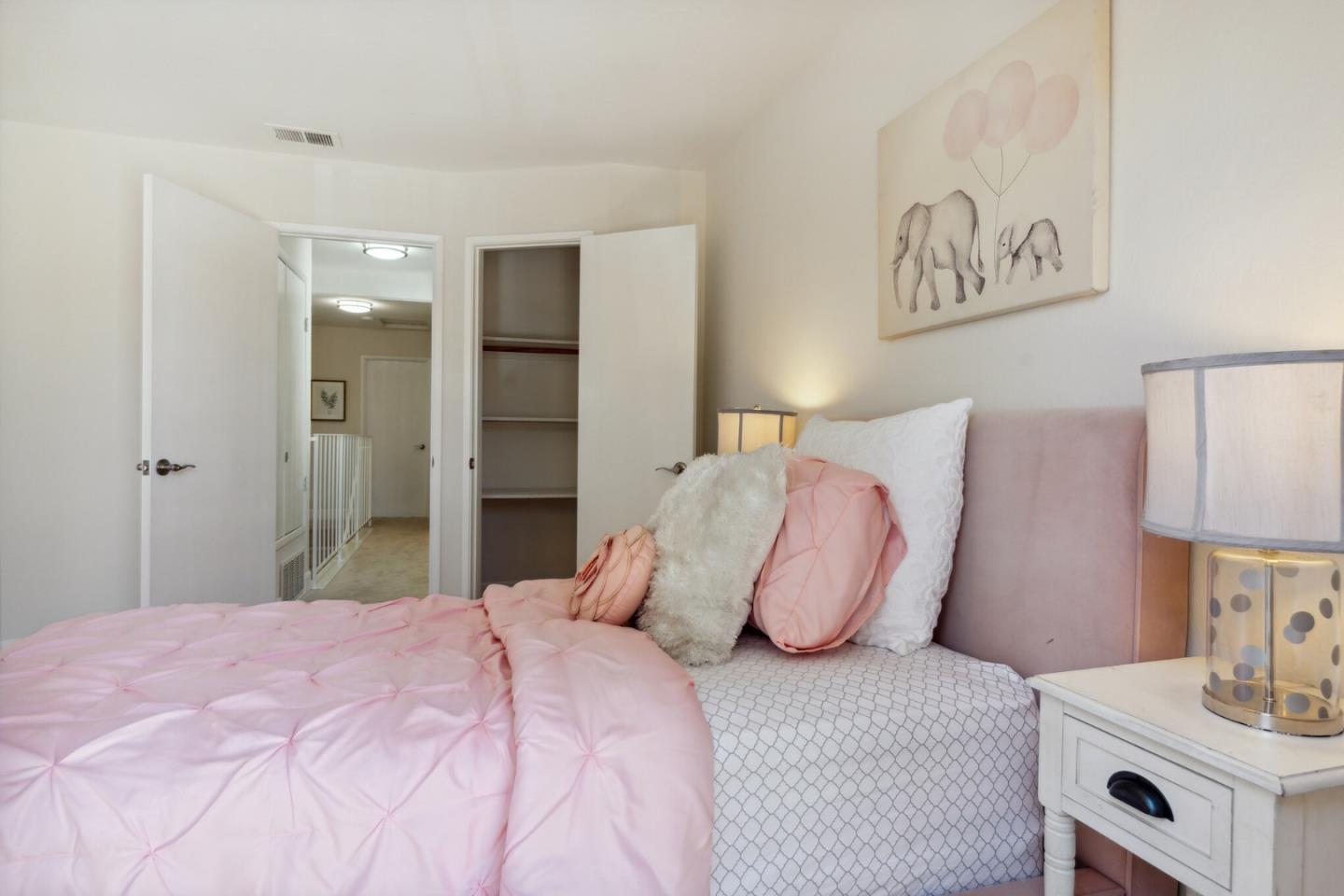 101 Redding Road, Unit B2 Campbell, CA 95008 - Photo 29 of 32 a bedroom with a bed and a lamp