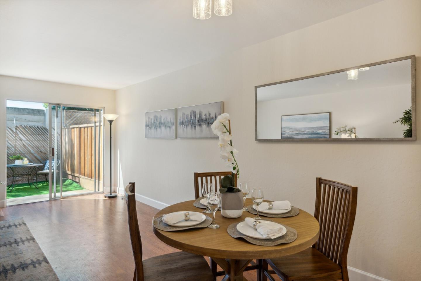 101 Redding Road, Unit B2 Campbell, CA 95008 - Photo 9 of 32 a view of a dining room with furniture and wooden floor